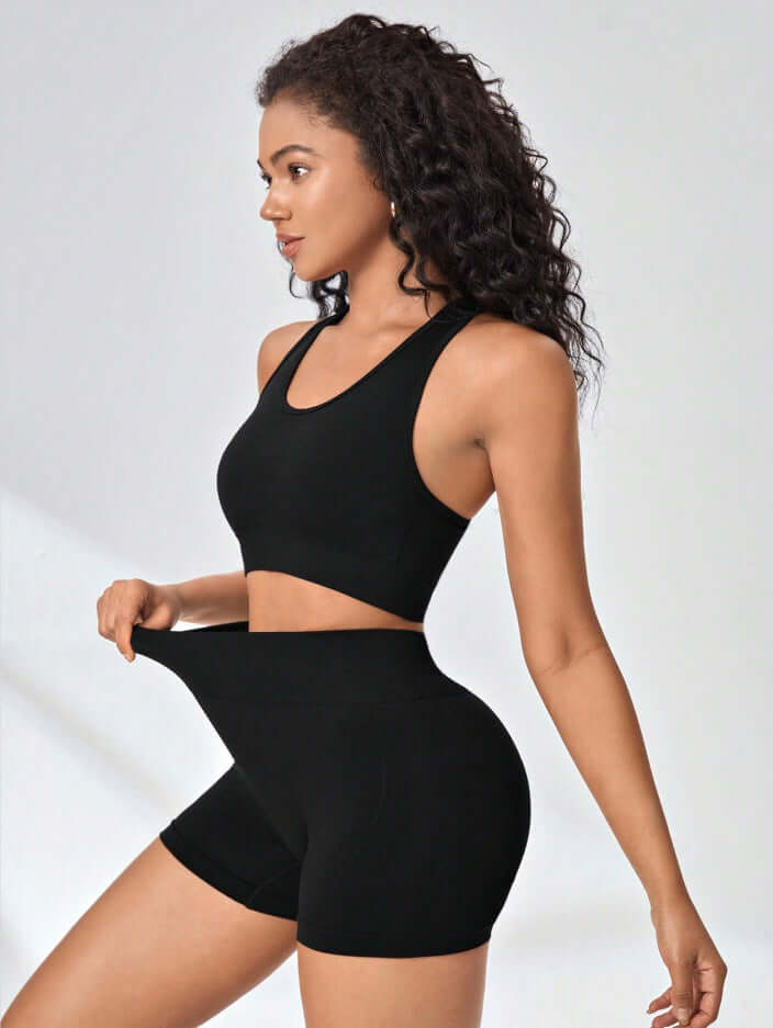 High-Intensity Workout Set – Stretch Vest & Shorts model showcasing flexible black sports outfit for summer workouts