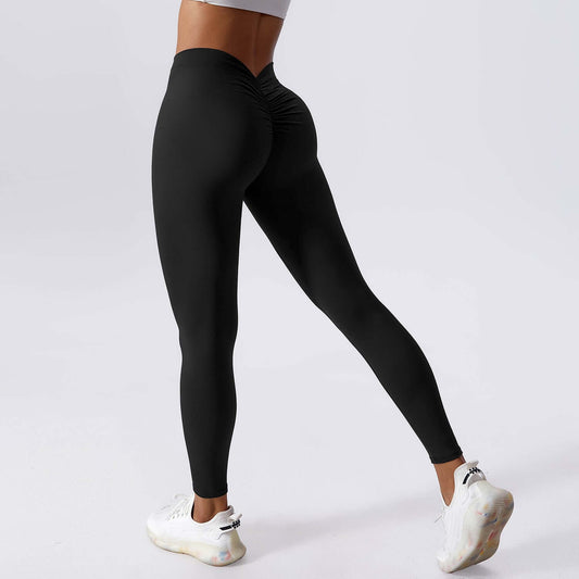 Woman wearing black lift yoga leggings, showcasing a flattering fit and stylish design for activewear.