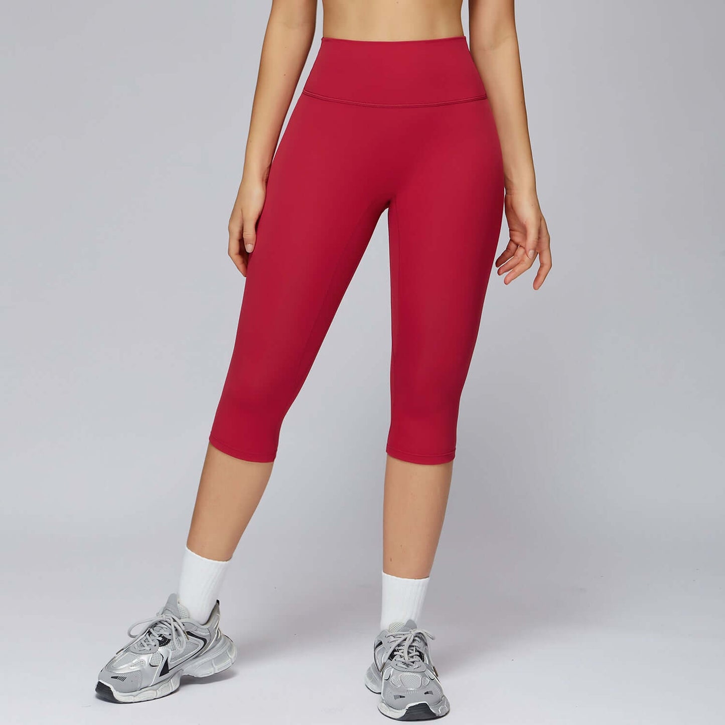 3/4 Brushed Yoga Knee-Length Pants – High-Waist Quick-Dry Slim Fit in red worn by a model.