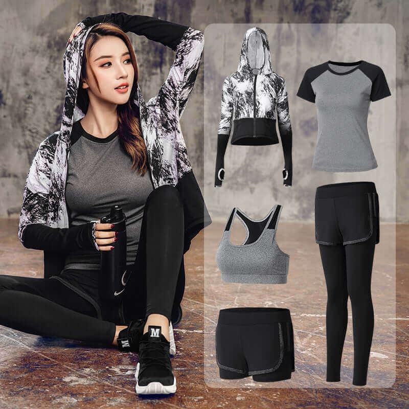 5-piece women’s activewear set in black, featuring sports bra, tops, jacket, shorts, and leggings for fitness performance.