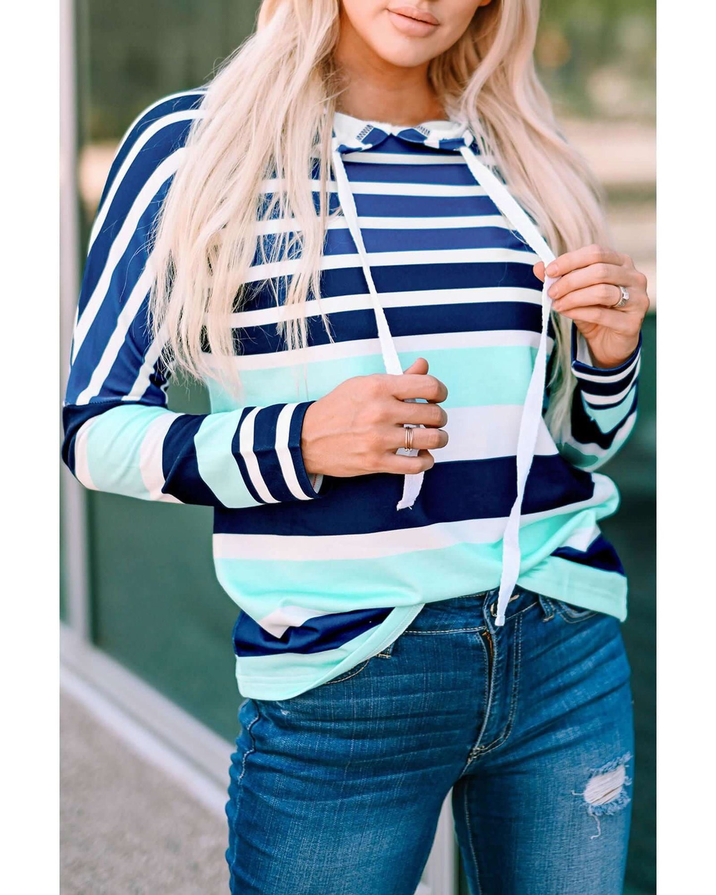 Women's casual Azura Exchange striped drawstring hoodie in vibrant colors, perfect for adventure and everyday comfort.