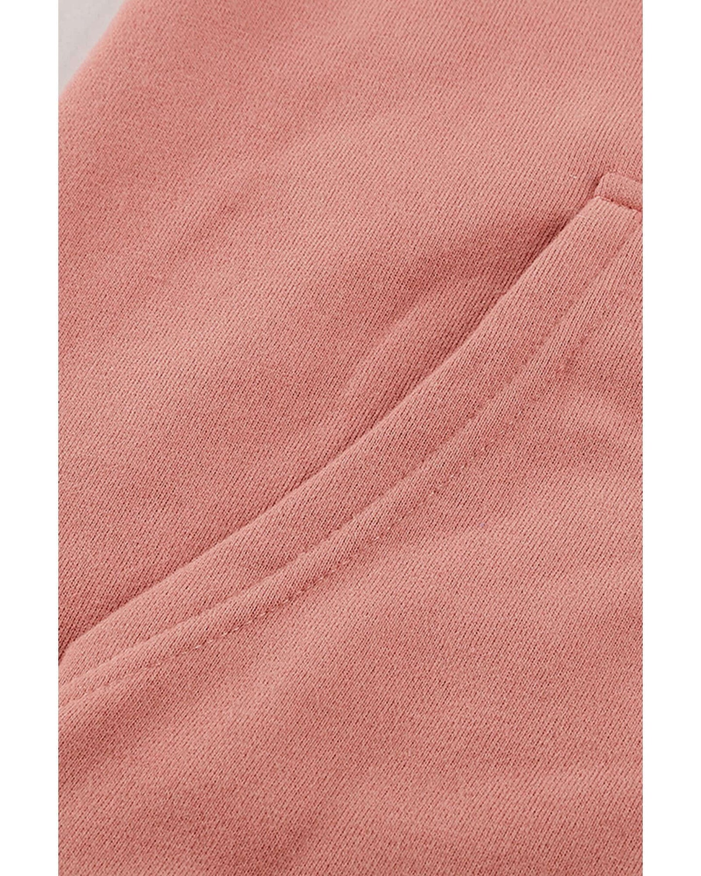 Close-up of the soft, pink fabric and pocket detail of Azura Exchange Women's Casual Zip-Up Hoodie.