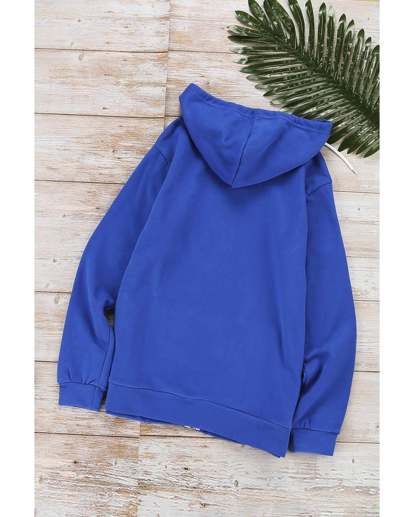 Azura Exchange Blue Zip-up Hoodie Jacket back view on wooden surface with a green leaf, ideal for activewear.