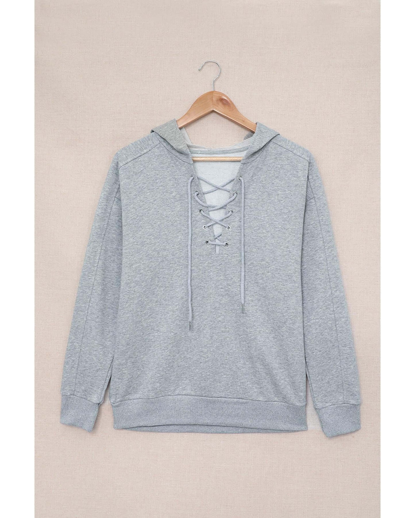 Azura Exchange Women's Lace-up Grey Casual Hoodie on hanger, featuring trendy lace-up detail for style and comfort.