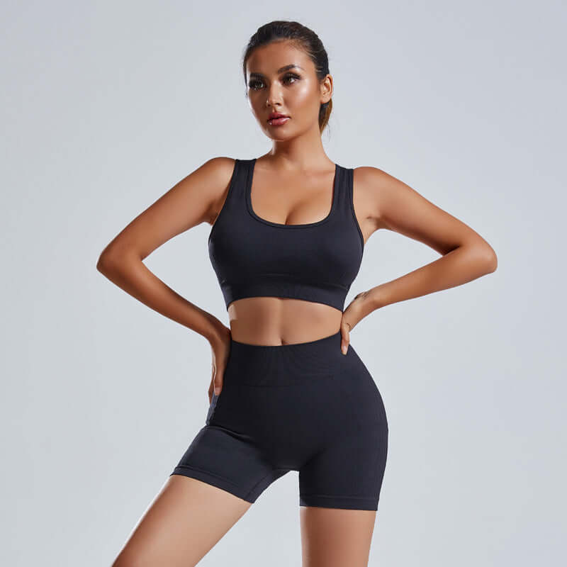 Women’s Activewear set in black, featuring a seamless sports vest and high-waist shorts for yoga and workouts.