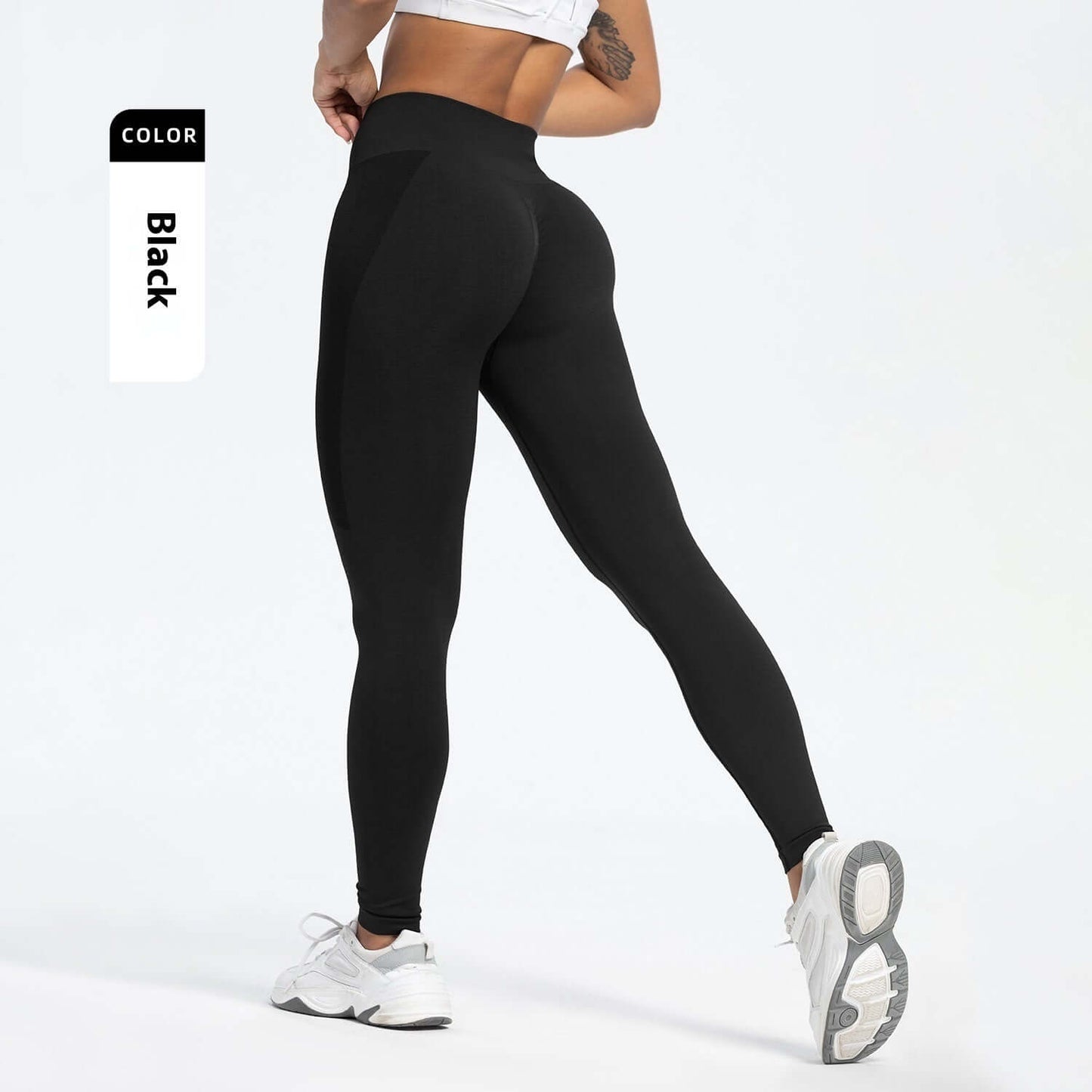 Black Seamless Yoga Pants – High-Waisted, Sculpting Fit shown from behind with smooth fit and hip-lifting design.