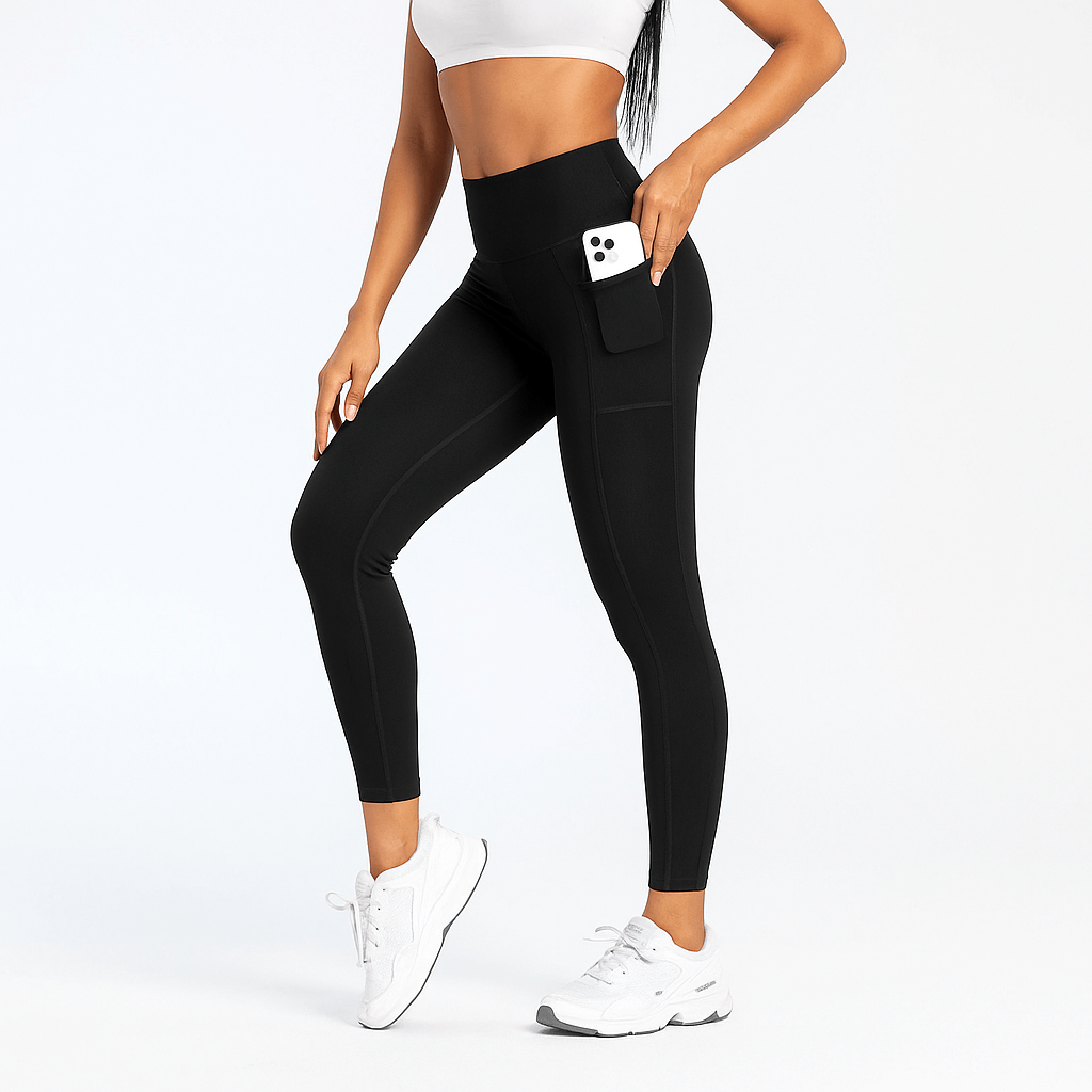 Black Slim-Fit Yoga Pants – High-Waisted with Pockets worn by a model, showcasing phone pocket and sleek design.