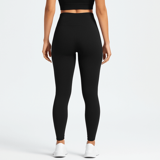 Black Seamless Yoga Pants – High-Waisted, Sculpting Fit on a model showcasing the back view.