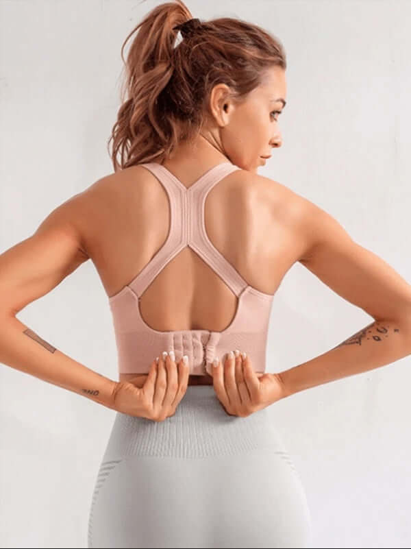 Black Xtreme Sports Bra – Seamless, Open-Back Fit, showcasing its trendy open-back design and supportive fit.
