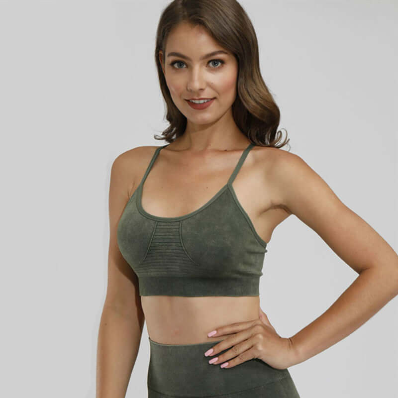 Black Xtreme Sports Bra – Seamless, Open-Back Fit modeled by a woman in olive green, showcasing premium activewear style.
