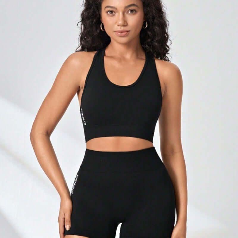 High-Intensity Workout Set – Stretch Vest & Shorts modeled by a woman in a black sports bra and matching shorts.