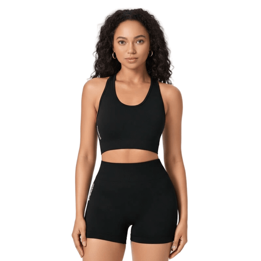 High-Intensity Workout Set – Stretch Vest & Shorts modeled by a woman in a black sports bra and matching shorts.