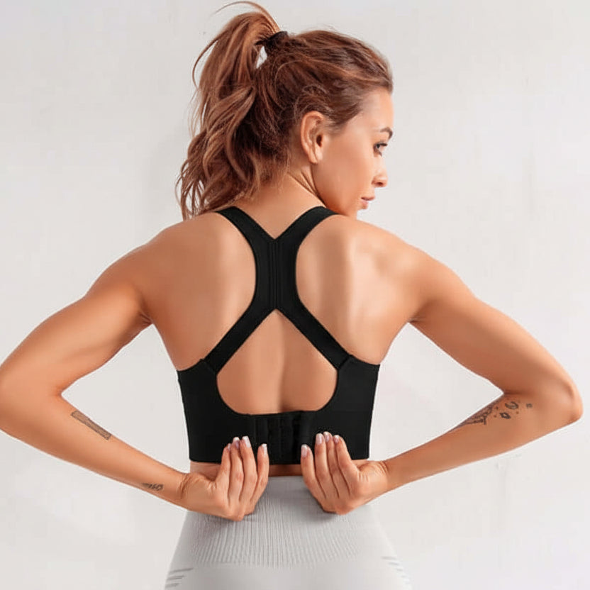 Black Xtreme Sports Bra – Seamless, Open-Back Fit worn by a model showcasing its stylish design and functionality.