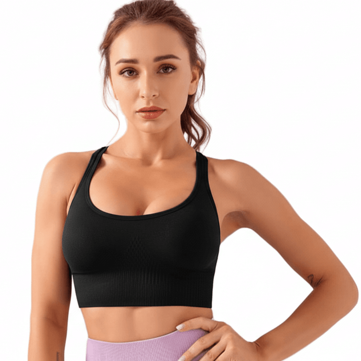 Black Xtreme Sports Bra – Seamless, Open-Back Fit on model showcasing bold athletic style.