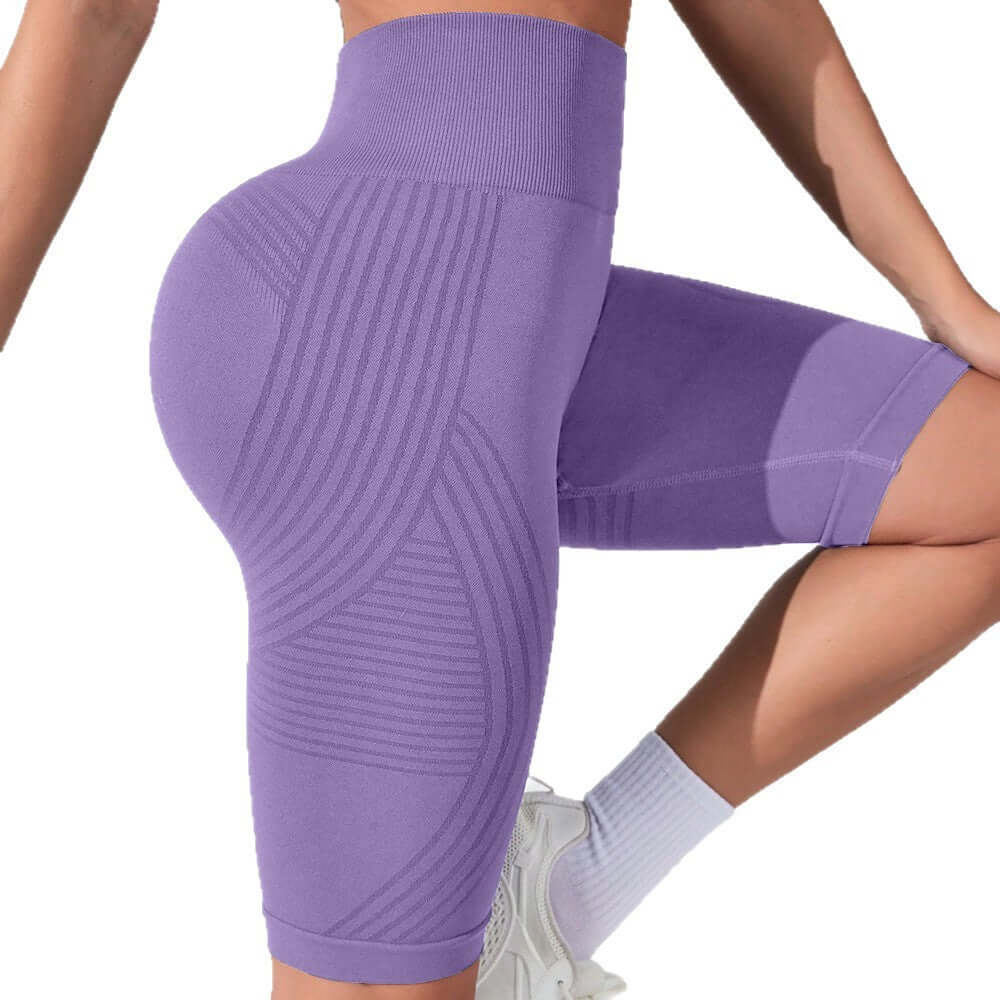 Seamless High-Waist Fifth Yoga Pants – Hip-Lifting Peach Fit in purple, designed for optimal comfort and support.