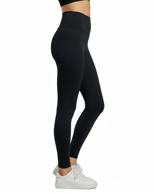 Black Seamless Yoga Pants – Sculpting, Sweat-Wicking in a stylish side view, perfect for workouts.