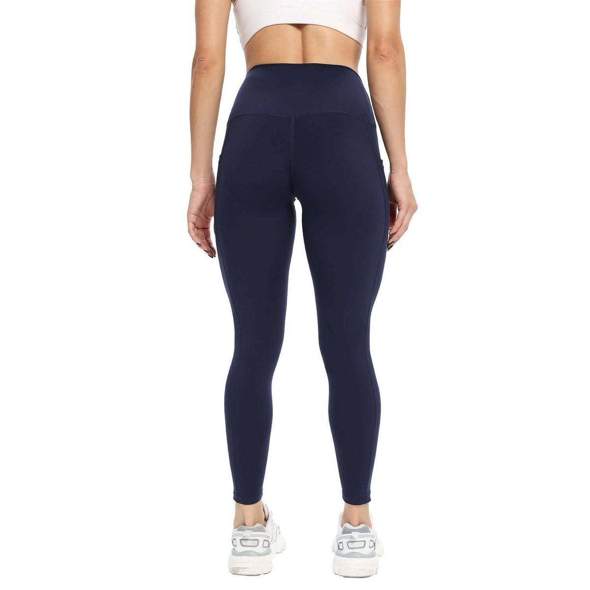 Black Slim-Fit Yoga Pants – High-Waisted with Pockets back view, showcasing slim fit and high waistband.