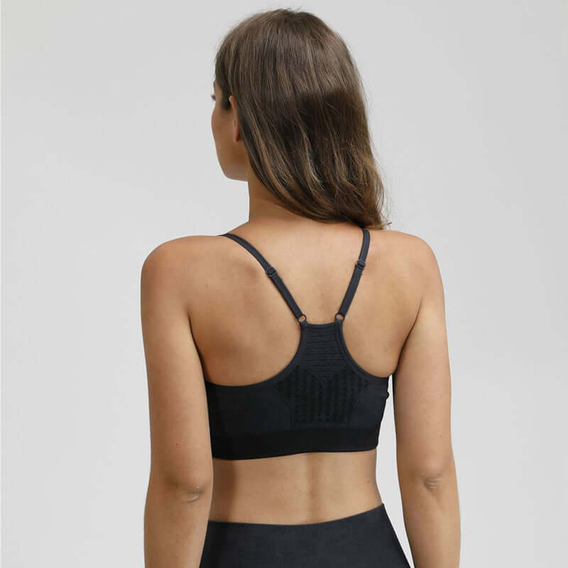 Black Xtreme Sports Bra – Seamless, Open-Back Fit showcasing the back design and straps, perfect for activewear.