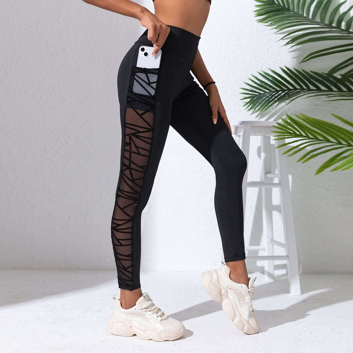 Black Plus Size Compression Leggings – Mesh, Sculpting Fit on a model, showcasing breathable comfort and flexible design.