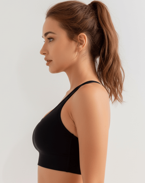 Black Xtreme Sports Bra – Seamless, Open-Back Fit shown from the side, ideal for confident workouts.