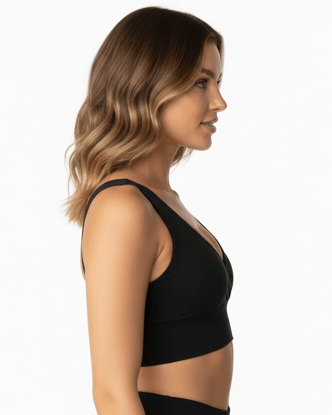 Black Cotton Yoga Sports Bra – Minimalist, Stretch Fit worn by model, showcasing a side profile in a minimalist design.