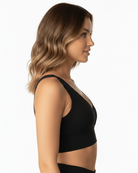 Black Cotton Yoga Sports Bra – Minimalist, Stretch Fit worn by model, showcasing a side profile in a minimalist design.