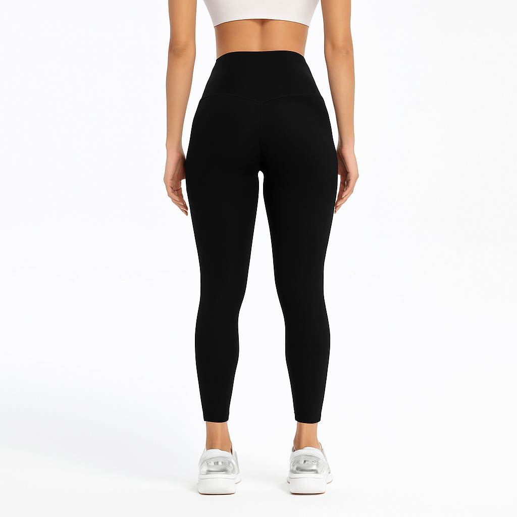 Black Slim-Fit Yoga Pants – High-Waisted with Pockets, perfect fit for women's activewear, featuring a sleek back view.
