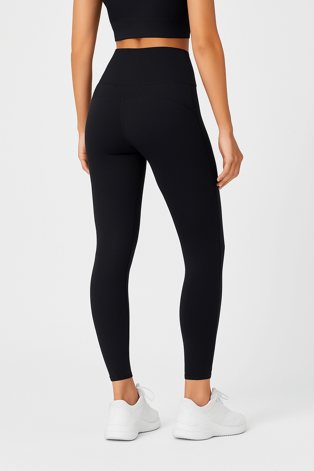 Black Contrast Yoga Pants – Sculpting, High-Waist Fit showcasing a woman's back view in stylish black leggings.