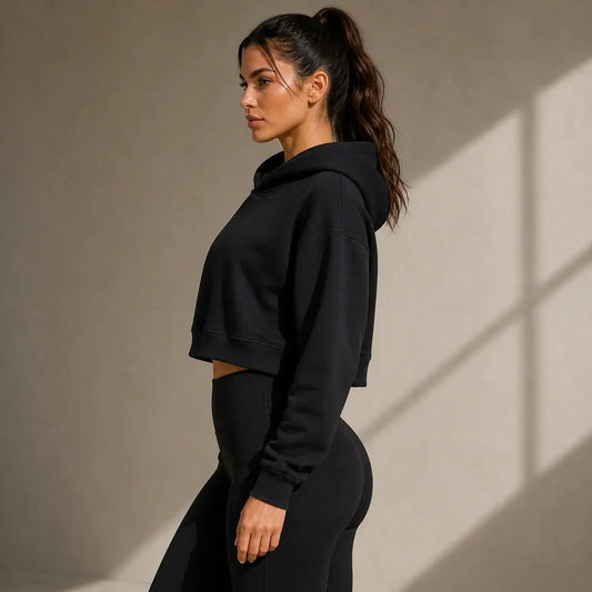 Layna Cropped Layer Hoodie in black, showcasing a stylish cropped fit ideal for activewear.