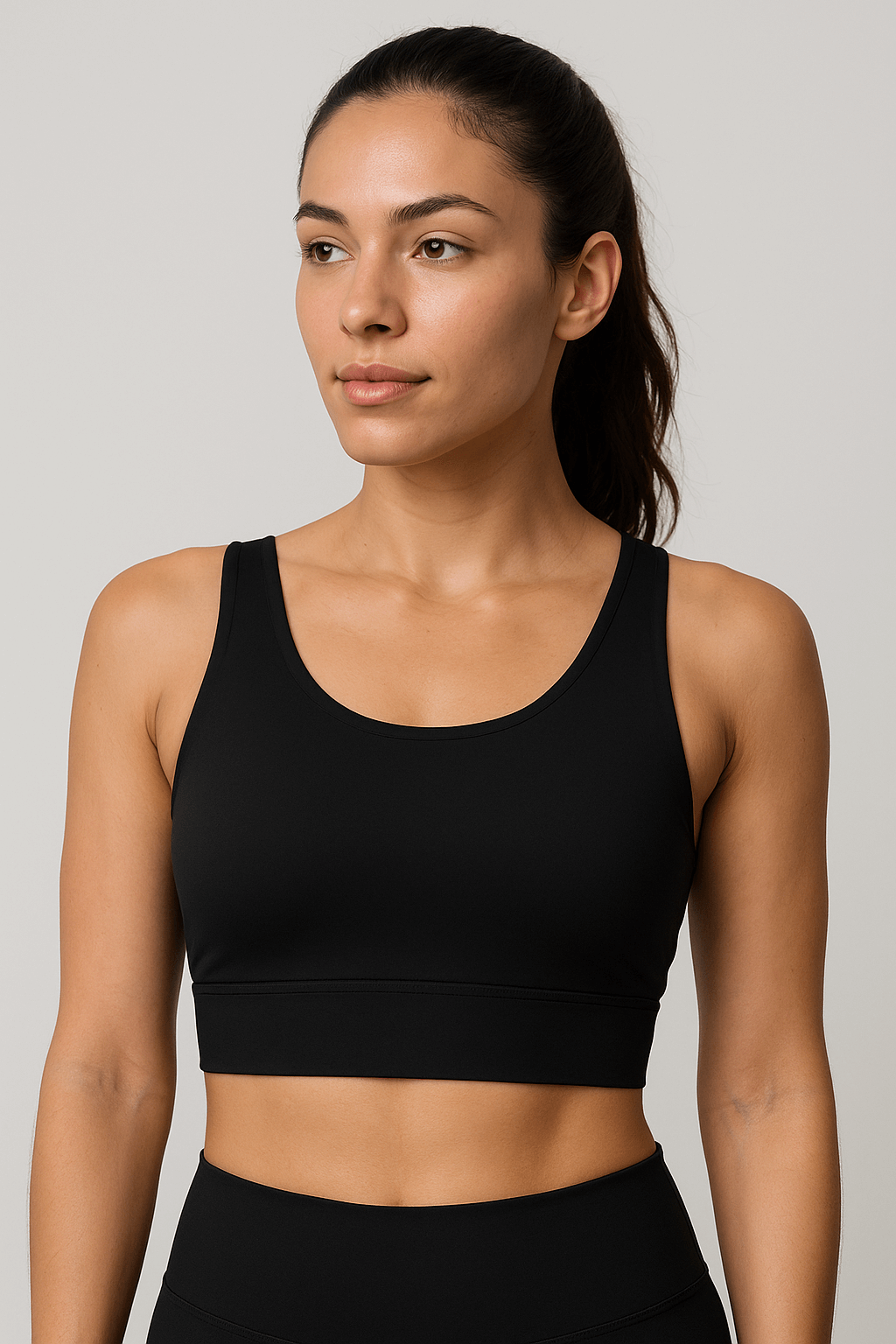 Black No-Bounce Sports Bra – Shockproof, Beauty Back Design worn by a woman for support and style during workouts.